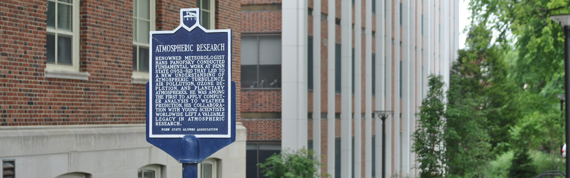 metal sign on Penn State campus that describes atmospheric research at Penn State