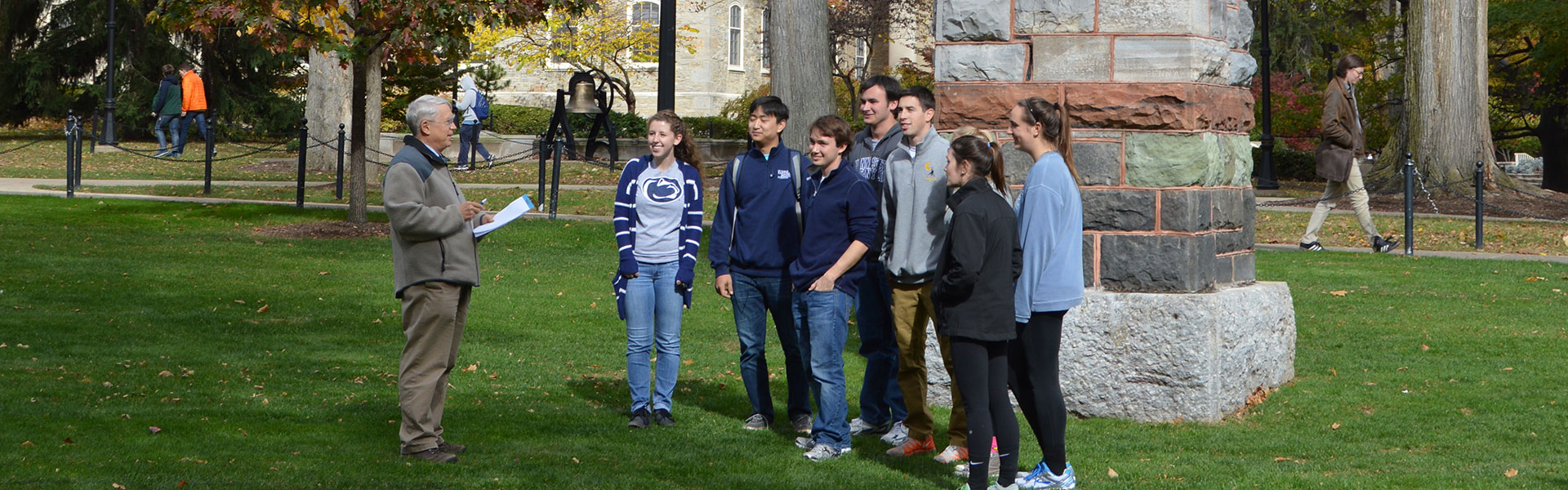 Nels Shirer with a group of students outside