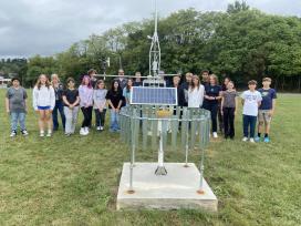 Eighth-graders at Waynesboro Area Middle School and school district personnel visit the new weather station along East Second Street.