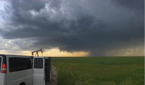 Scientists in a truck outfitted with instruments race toward a storm. National Severe Storms Lab/NOAA