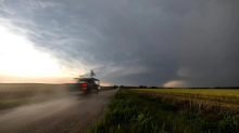 Scientists in a truck outfitted with instruments race toward a storm. National Severe Storms Lab/NOAA