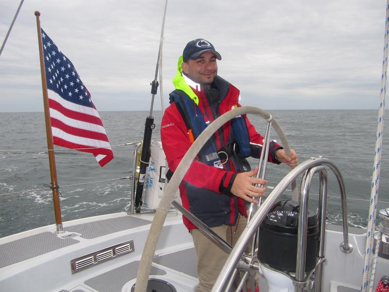 Guido Cervone at the helm of a sail boat